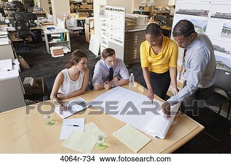 Picture - Group collaborating on project at office. Fotosearch