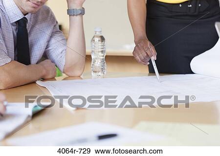 Group collaborating on project at office, close-up View Large Photo Image Stock Photo - Group collaborating on project at office, close-up. Fotosearch