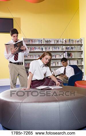 Group of high school students hanging out in library View Large Photo Image Stock Photography - Group of high school students hanging out in library. Fotosearch