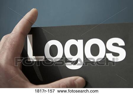 Hand holding card highlighting the word logos View Large Photo Image Stock Photo - Hand holding card highlighting the word logos. Fotosearch