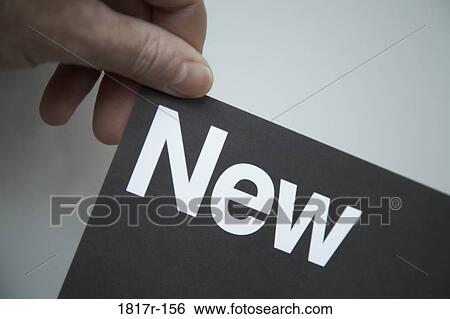 Hand holding card highlighting the word new View Large Photo Image Stock Photograph - Hand holding card highlighting the word new. Fotosearch