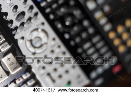 Stock Photo - High angle view of remote controls. Fotosearch