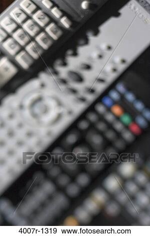Stock Photo - High angle view of remote controls. Fotosearch