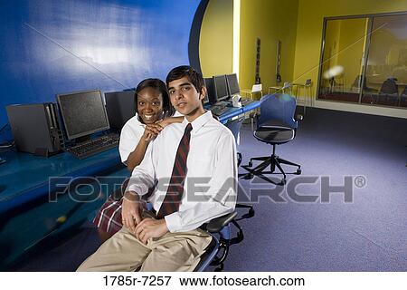 High school students wearing a uniforms sitting in a computer lab View Large Photo Image Stock Photo - High school students wearing a uniforms sitting in a computer lab. Fotosearch