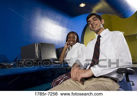 High school students wearing a uniforms sitting in a computer lab View Large Photo Image Stock Photograph - High school students wearing a uniforms sitting in a computer lab. Fotosearch