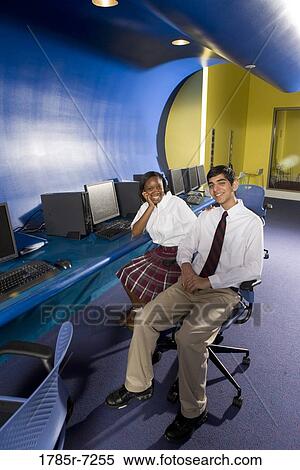 High school students wearing a uniforms sitting in a computer lab View Large Photo Image Stock Photography - High school students wearing a uniforms sitting in a computer lab. Fotosearch