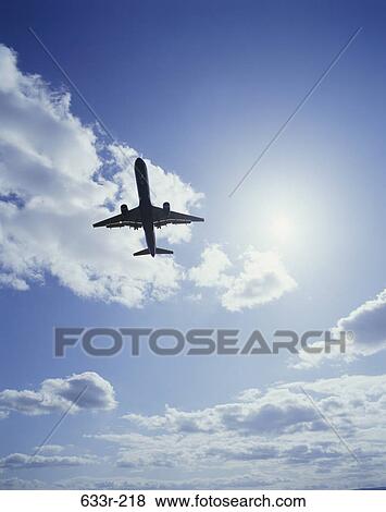 Low angle view of a Boeing 757 airplane flying in the sky View Large Photo Image Stock Photo - Low angle view of a Boeing 757 airplane flying in the sky. Fotosearch
