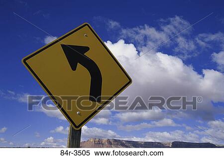 Low angle view of a road curve sign View Large Photo Image Stock Photography - Low angle view of a road curve sign. Fotosearch