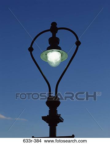 Low angle view of a street light View Large Photo Image Picture - Low angle view of a street light. Fotosearch
