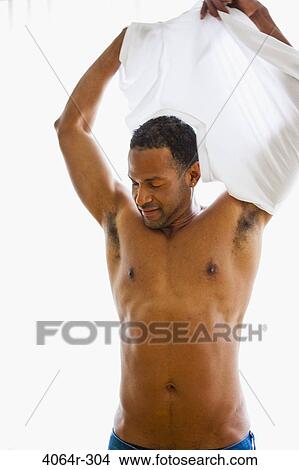 Man getting dressed View Large Photo Image Picture - Man getting dressed. Fotosearch