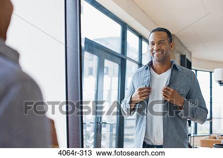 Man getting dressed View Large Photo Image Stock Image - Man getting dressed. Fotosearch