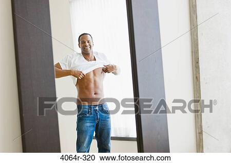 Man getting dressed View Large Photo Image Stock Image - Man getting dressed. Fotosearch