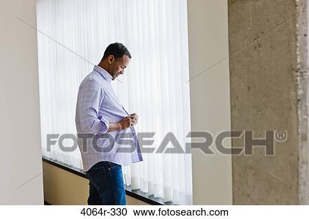 Man getting dressed View Large Photo Image Stock Image - Man getting dressed. Fotosearch