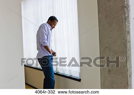 Man getting dressed View Large Photo Image Stock Image - Man getting dressed. Fotosearch