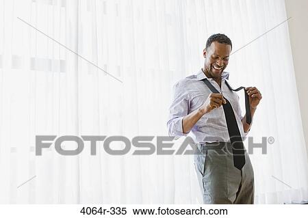 Man getting dressed View Large Photo Image Stock Photography - Man getting dressed. Fotosearch