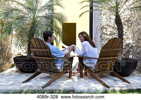 Mexico, Couple relaxing in chairs at resort View Large Photo Image Stock Photo - Mexico, Couple relaxing in chairs at resort. Fotosearch
