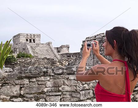 Mexico, Quintana Roo, Tulum, Young woman photographing pyramid at archaeological site View Large Photo Image Stock Photograph - Mexico, Quintana Roo, Tulum, Young woman photographing pyramid at archaeological site. Fotosearch