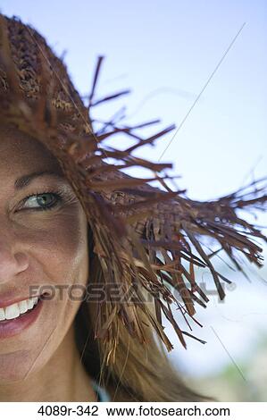 Mexico, Woman wearing straw hat and smiling View Large Photo Image Stock Image - Mexico, Woman wearing straw hat and smiling. Fotosearch