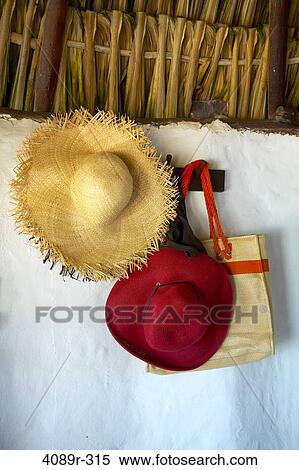 Mexico, Yucatan Peninsula, Quintana Roo, Tulum, Straw hat and bag hanging from hook View Large Photo Image Stock Photography - Mexico, Yucatan Peninsula, Quintana Roo, Tulum, Straw hat and bag hanging from hook. Fotosearch