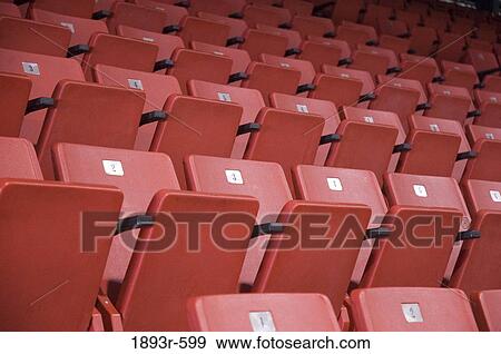 numbered red stadium seating in an indoor hockey arena in owen sound, ontario View Large Photo Image Stock Photo - numbered red stadium seating in an indoor hockey arena in owen sound, ontario. Fotosearch