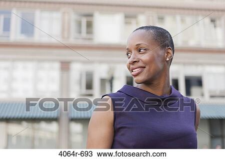 Stock Image - Outdoor portrait of smiling businesswoman. Fotosearch