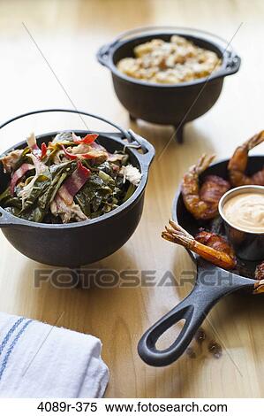 Pans of shrimp with collard greens and macaroni with cheese View Large Photo Image Stock Photography - Pans of shrimp with collard greens and macaroni with cheese. Fotosearch