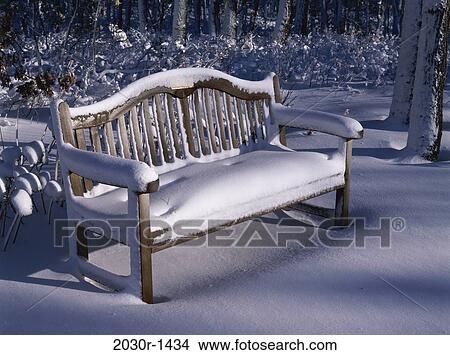 Park bench covered in snow View Large Photo Image Picture - Park bench covered in snow. Fotosearch