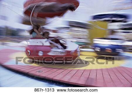 People on an amusement park ride View Large Photo Image Stock Image - People on an amusement park ride. Fotosearch