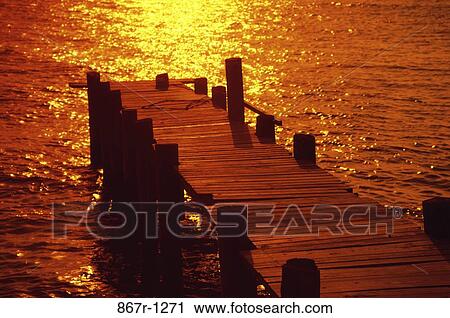 Pier at sunset View Large Photo Image Stock Image - Pier at sunset. Fotosearch