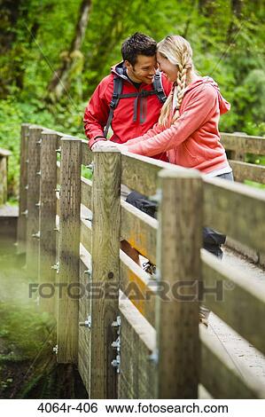 Portland, Oregon, USA, Couple on bridge in forest View Large Photo Image Stock Photograph - Portland, Oregon, USA, Couple on bridge in forest. Fotosearch