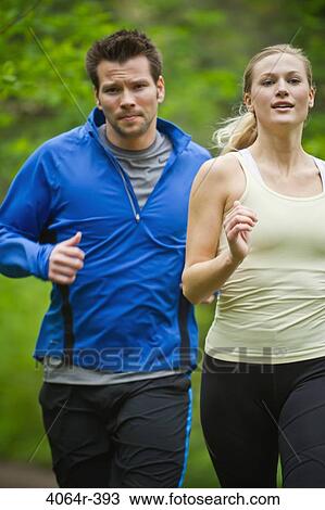 Portland, Oregon, USA, Couple running together on trail in forest View Large Photo Image Stock Image - Portland, Oregon, USA, Couple running together on trail in forest. Fotosearch