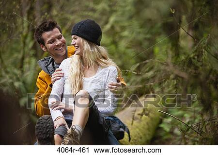 Portland, Oregon, USA, Couple taking lunch break on log View Large Photo Image Stock Image - Portland, Oregon, USA, Couple taking lunch break on log. Fotosearch