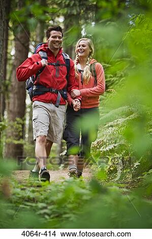Portland, Oregon, USA, Couple walking on trail through forest View Large Photo Image Picture - Portland, Oregon, USA, Couple walking on trail through forest. Fotosearch
