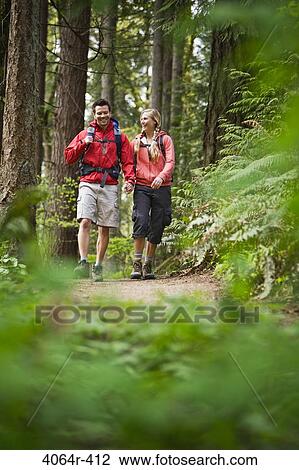 Portland, Oregon, USA, Couple walking on trail through forest View Large Photo Image Stock Image - Portland, Oregon, USA, Couple walking on trail through forest. Fotosearch