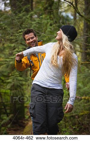 Portland, Oregon, USA, Couple walking along log in forest View Large Photo Image Stock Image - Portland, Oregon, USA, Couple walking along log in forest. Fotosearch