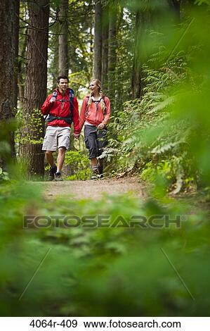 Portland, Oregon, USA, Couple walking on trail through forest View Large Photo Image Stock Photo - Portland, Oregon, USA, Couple walking on trail through forest. Fotosearch