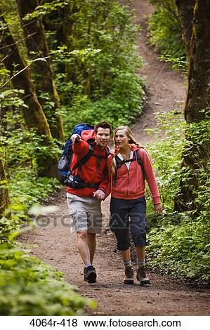 Portland, Oregon, USA, Couple walking on trail through forest View Large Photo Image Stock Photo - Portland, Oregon, USA, Couple walking on trail through forest. Fotosearch