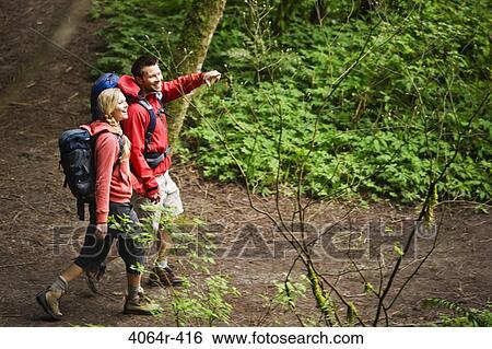 Portland, Oregon, USA, Couple walking on trail through forest View Large Photo Image Stock Photograph - Portland, Oregon, USA, Couple walking on trail through forest. Fotosearch