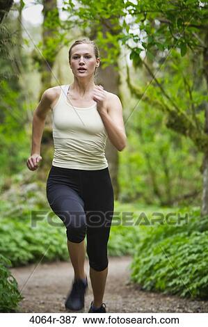 Portland, Oregon, USA, Woman trail running in forest View Large Photo Image Stock Photo - Portland, Oregon, USA, Woman trail running in forest. Fotosearch