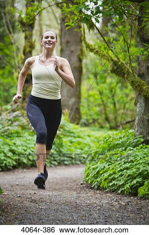 Portland, Oregon, USA, Woman trail running in forest View Large Photo Image Stock Photograph - Portland, Oregon, USA, Woman trail running in forest. Fotosearch