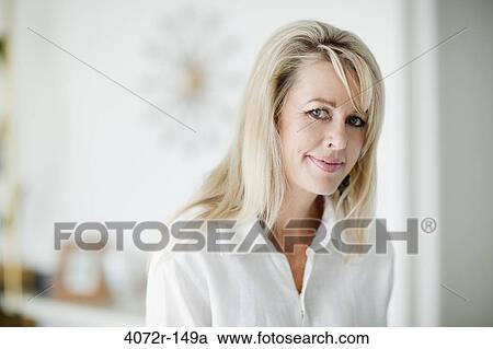 Stock Image - Portrait of a businesswoman smiling. Fotosearch