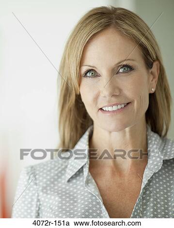 Stock Image - Portrait of a businesswoman smiling. Fotosearch