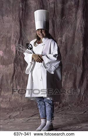 Portrait of a girl in a chef's uniform smiling View Large Photo Image Stock Image - Portrait of a girl in a chef's uniform smiling. Fotosearch