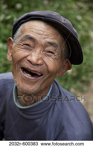 Portrait of a man laughing, Kunming, Yunnan Province, China View Large Photo Image Stock Image - Portrait of a man laughing, Kunming, Yunnan Province, China. Fotosearch