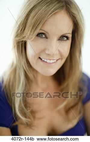 Portrait of a mature woman smiling View Large Photo Image Stock Image - Portrait of a mature woman smiling. Fotosearch