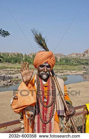 Portrait of a sadhu blessing, Hampi, Karnataka, India View Large Photo Image Stock Photo - Portrait of a sadhu blessing, Hampi, Karnataka, India. Fotosearch