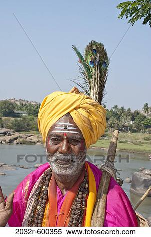Portrait of a sadhu blessing, Hampi, Karnataka, India View Large Photo Image Stock Photography - Portrait of a sadhu blessing, Hampi, Karnataka, India. Fotosearch