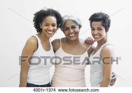 Portrait of a senior woman with her daughters smiling View Large Photo Image Picture - Portrait of a senior woman with her daughters smiling. Fotosearch