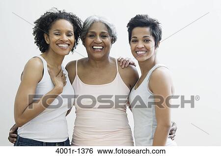 Portrait of a senior woman with her daughters smiling View Large Photo Image Stock Photograph - Portrait of a senior woman with her daughters smiling. Fotosearch