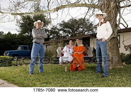 Portrait of a Tex-Mex family with adult children in front yard of house View Large Photo Image Stock Image - Portrait of a Tex-Mex family with adult children in front yard of house. Fotosearch